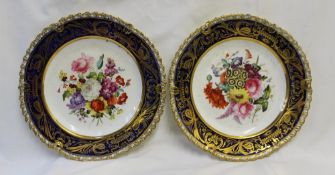 A pair of 19th century English cabinet plates  decorated to the centre with a spray of garden