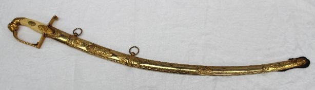 A dress sword, the ivory grip inset with a gilt metal plaque,