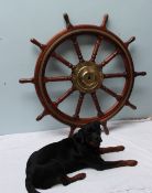 A large mahogany and brass ship's wheel, with turned spokes and handles, 122cm diameter,