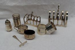 A George V silver four division toast rack, Sheffield, 1936 together with another toast rack,