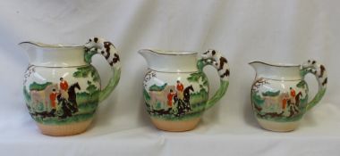 A set of three Wedgwood pottery hunting jugs, moulded with huntsmen and hounds,