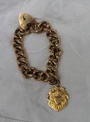 A 9ct yellow gold bracelet with padlock clasp and medallion  approximately 68 grams