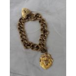 A 9ct yellow gold bracelet with padlock clasp and medallion  approximately 68 grams