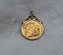 A George V gold sovereign dated 1915 in a yellow metal mount