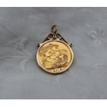 A George V gold sovereign dated 1915 in a yellow metal mount