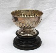 A modern silver rose bowl with a gadrooned body on a spreading foot, indistinct marks,