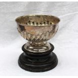 A modern silver rose bowl with a gadrooned body on a spreading foot, indistinct marks,