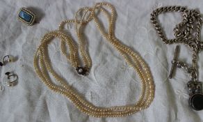 A seed pearl three strand necklace, together with a pearl mourning brooch,