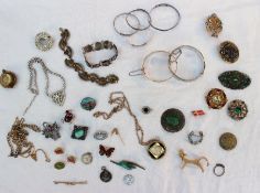 Assorted costume jewellery including brooches, bracelets,