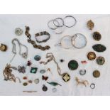 Assorted costume jewellery including brooches, bracelets,