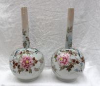 A pair of Chinese porcelain bottle vases painted with birds, flowers and leaves,