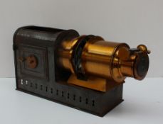 An Andrew H Baird tin plate and lacquered brass magic lantern,