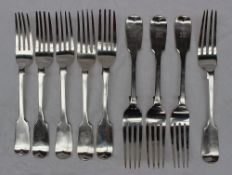 A set of four Victorian silver fiddle pattern table forks, London, 1861,