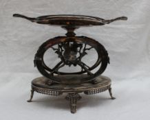 A Meriden electroplated table centrepiece cast with birds and leaves on an oval base,