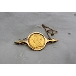 A Victorian gold sovereign dated 1899, mounted in a 9ct gold brooch,