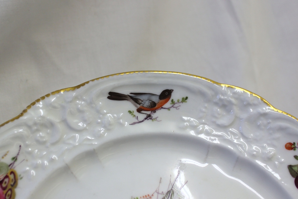 A Nantgarw porcelain plate decorated with birds and sprays of garden flowers to a moulded and gilt - Image 3 of 5