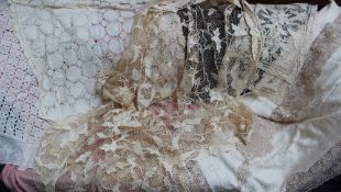 Lace table cloths together with assorted linen