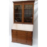 A 19th century  mahogany bureau bookcase the moulded dentil cornice above a shell inlaid frieze