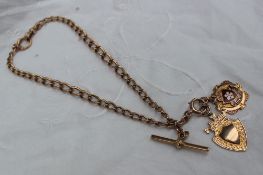 A 9ct gold Albert chain with 9ct gold medallions,