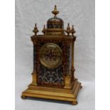 A 19th century gilt metal and champleve enamel decorated mantle clock, with a vase finial and dome ,