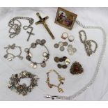 Assorted costume jewellery including a yellow metal charm bracelet, a bracelet set with coins,