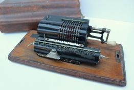 A Muldivo calculating machine, with a black lacquer finish No.