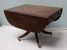 A Regency mahogany sofa table the rectangular top with drop flaps above drawers to either end on  a