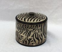 A Dennis China Works pottery trial biscuit barrel and cover decorated in the Black Tiger pattern,