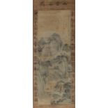 An Oriental scroll on paper of a figure on a river bank in a mountain range,