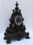 A spelter mantle clock, with a bronzed finish,