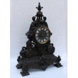 A spelter mantle clock, with a bronzed finish,