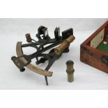 A black lacquer sextant with a brass and silvered vernier, mirror,