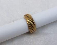 An 18ct yellow gold Pomellato ring  with ten intertwined bands, approximately 21.