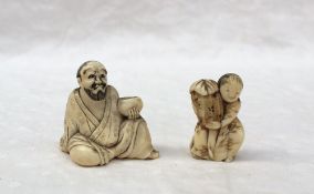 An ivory netsuke in the form of a seated bearded gentleman holding a bowl, 4.