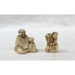 An ivory netsuke in the form of a seated bearded gentleman holding a bowl, 4.