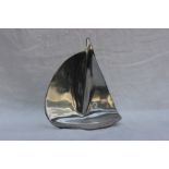 A Hoselton white metal sculpture of a goose in flight, signed, No.