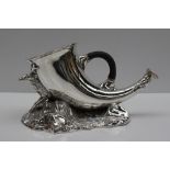 An electroplated nickel silver spoon warmer of horn form mounted on a stag and rocky base,