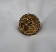 A George V gold sovereign,