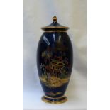 A Carlton Ware mikado pattern vase and cover, with enamelled decoration to a mottled blue ground,