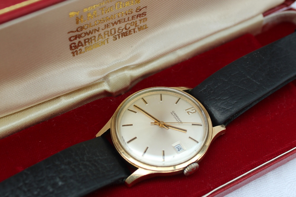 A 9ct yellow gold Gentleman's Garrard automatic wristwatch, with a silvered dial,