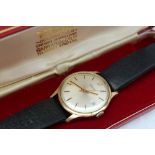 A 9ct yellow gold Gentleman's Garrard automatic wristwatch, with a silvered dial,