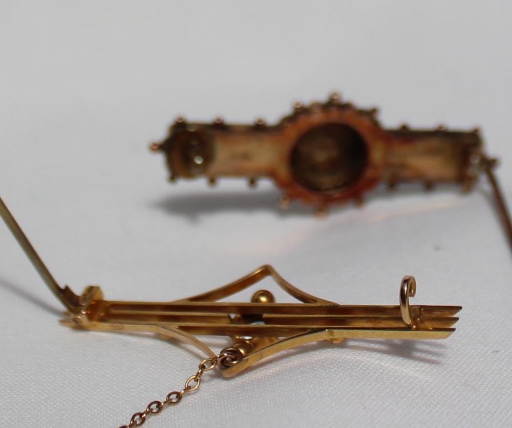 A Victorian 9ct yellow gold bar brooch, the central star set with seed pearls, - Image 2 of 2