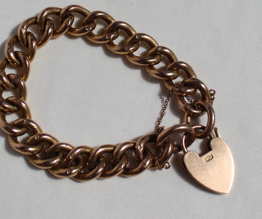 A yellow metal bracelet with a padlock clasp marked 9ct, - Image 2 of 2