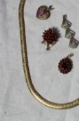 A 9ct yellow gold necklace approximately 9 grams together with a 9ct gold garnet set pendant and