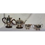 A late Victorian four piece teaset, comprising a teapot, hot water jug, cream jug and sugar basin,