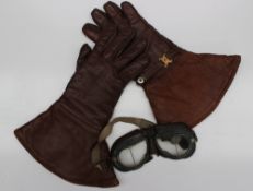 A pair of Turners Oakleaf gauntlet brown leather gloves together with a pair of goggles