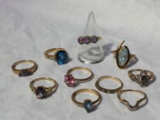 A 9ct gold amethyst set dress ring together with other semi precious set dress rings