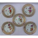 A set of five Meissen porcelain plates with a pierced gilt highlighted and bird painted border,