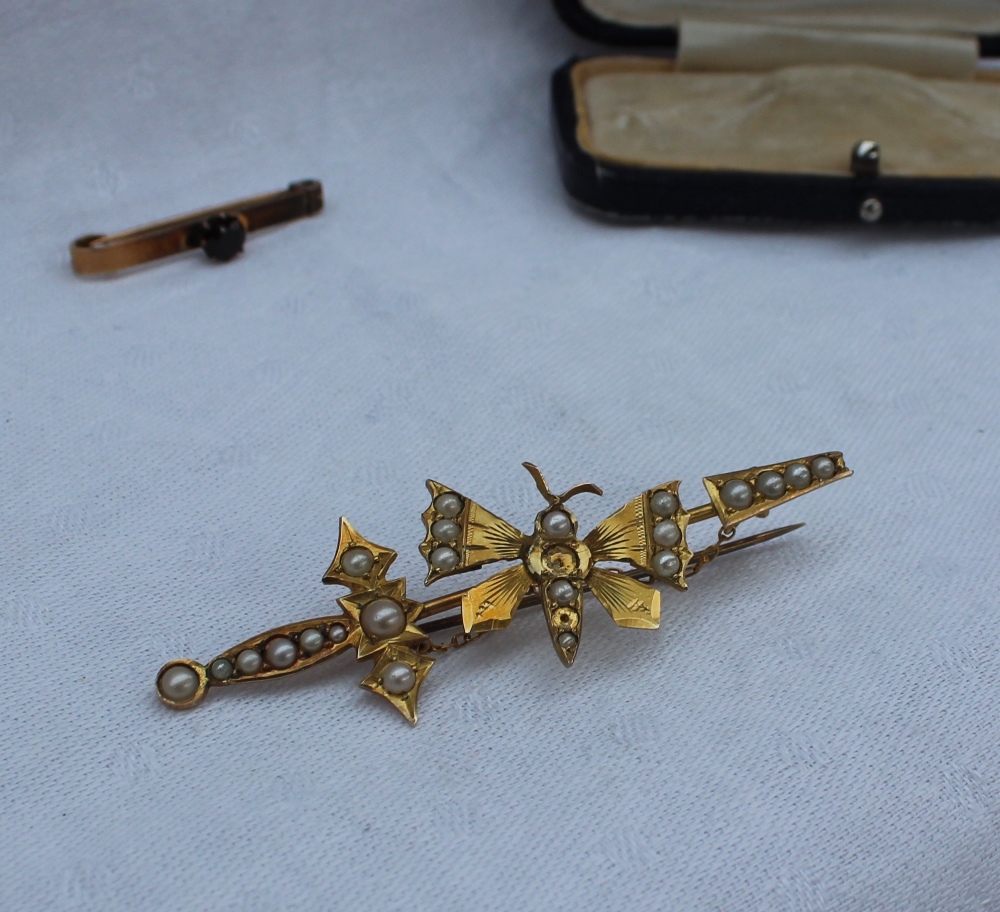 A yellow metal bar brooch in the form of a butterfly set with half pearls, marked 9, - Image 2 of 4