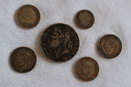 A George III crown dated 1822, together with a George II shilling 1758 and other coins,